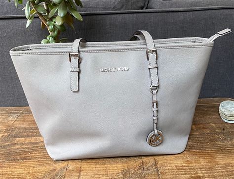 michael kors coin purse grey|Michael Kors close out totes.